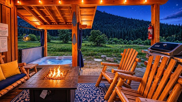 A wooden deck with a fire pit, outdoor seating, and a hot tub.