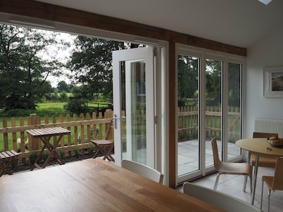 Historic remodelled stable barn near nature conservation