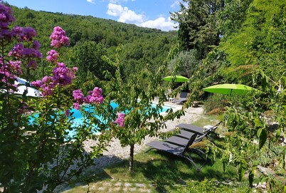 Charming detached house with terrace in a farmhouse with swimming pool and garden