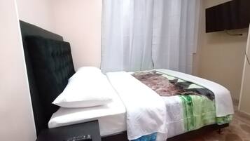 Minibar, desk, blackout drapes, iron/ironing board