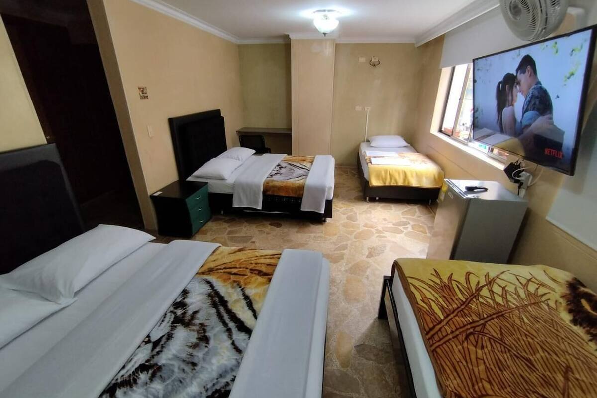 Basic Quadruple Room | Minibar, desk, blackout drapes, iron/ironing board (on request)
