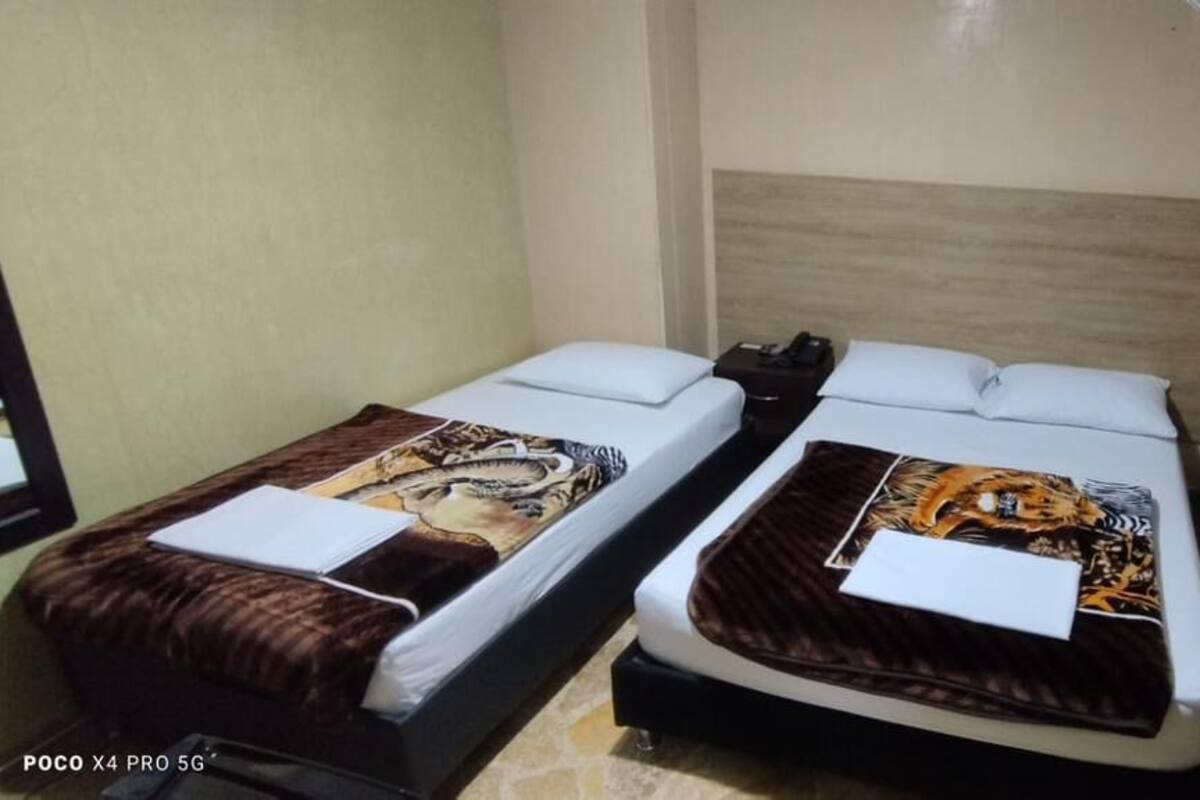 Basic Twin Room | Minibar, desk, blackout drapes, iron/ironing board (on request)