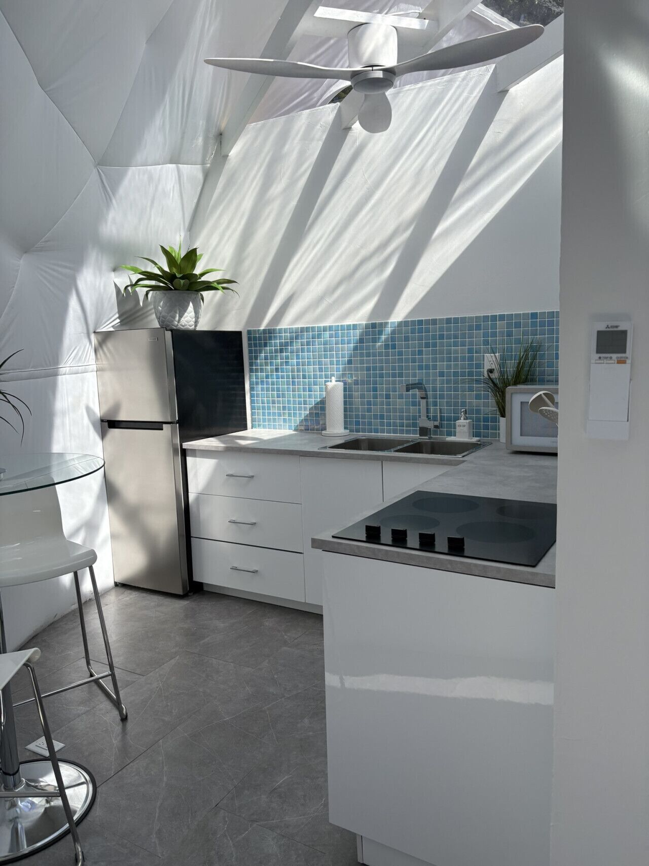 Fridge, microwave, coffee/tea maker, cookware/dishes/utensils