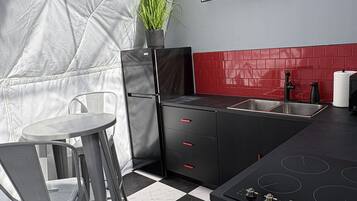 Fridge, microwave, coffee/tea maker, cookware/dishes/utensils