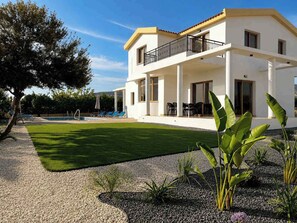 A two-story house with a balcony, a swimming pool, and a well-maintained lawn. - Luxury, Modern Villa with private pool & garden in Coral Bay area (Πέγεια, Πάφος)