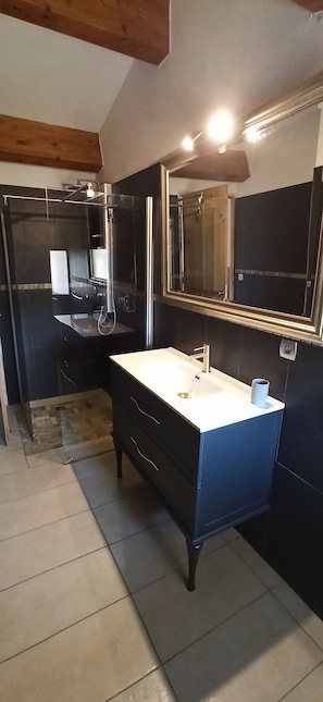 Shower, hair dryer, towels, toilet paper