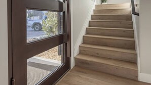 A staircase with wooden steps leading to a landing. - Private Pool & Hot Tub • Rooftop Fire Pit • Sleeps 20 • Near Zion (Washington)