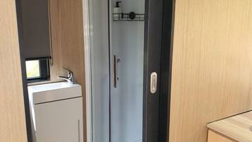 Shower, hair dryer, towels