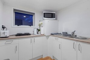 Fridge, microwave, stovetop, coffee/tea maker