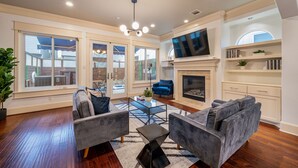 Deluxe House | Living area | 65-inch Smart TV with cable channels, TV, fireplace - 29th (Houston)