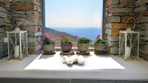 A stone-walled window with four potted plants and two lanterns. - 5 Bedroom Spectacular sunset view villa (Coressia)