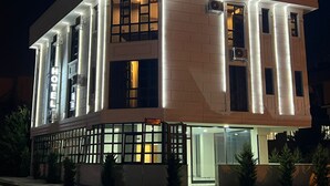 A hotel with a modern facade, featuring illuminated signage for "Beta Hotel" and a prominent entrance with glass doors. - Beta Hotel (Istanbul)