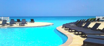 Steps from beach and infinity pool, Golf Cart Optional 