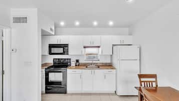 Apartment | Private kitchen | Full-size fridge, microwave, oven, stovetop