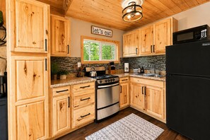Cabin, 1 Bedroom | Private kitchen | Fridge, oven, coffee/tea maker, toaster