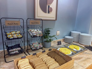 A breakfast buffet with labeled sections for French and Mexican bistro, cereal, and a tray of tortillas. - Hotel Faranda Alisas Santander, Ascend Hotel Collection (Santander)