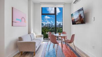 Exclusive Penthouse, 3 Bedrooms, Balcony, City View | Living area | 35-inch Smart TV with cable channels