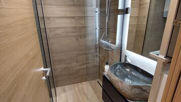 Shower, hair dryer, towels, soap