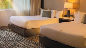 Habitació Deluxe | Caixa forta a l'habitació, cortines opaques i planxa i posts de planxar