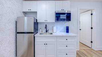 Fridge, microwave, coffee/tea maker, toaster