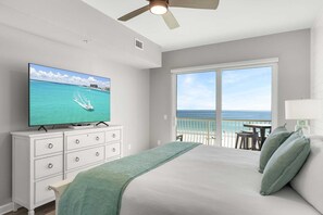 Enjoy ocean views from the comfort of your room, featuring a large bed, flat-screen TV, and dining space.