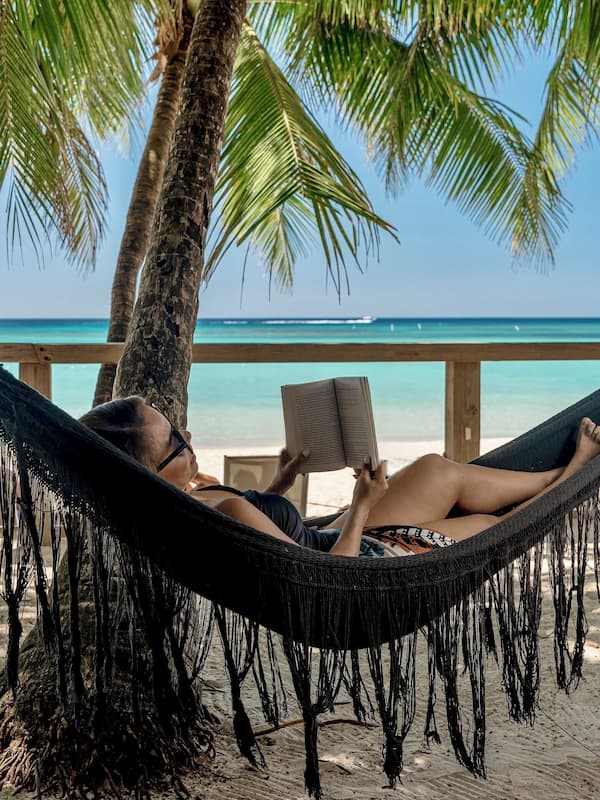 On the beach, white sand, sun loungers, beach towels