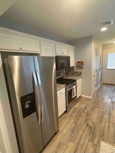 Perfect Oasis. NEW Home Away from Home with COVERED PARKING-Close to everything