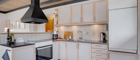 Fridge, stovetop, dishwasher, coffee/tea maker