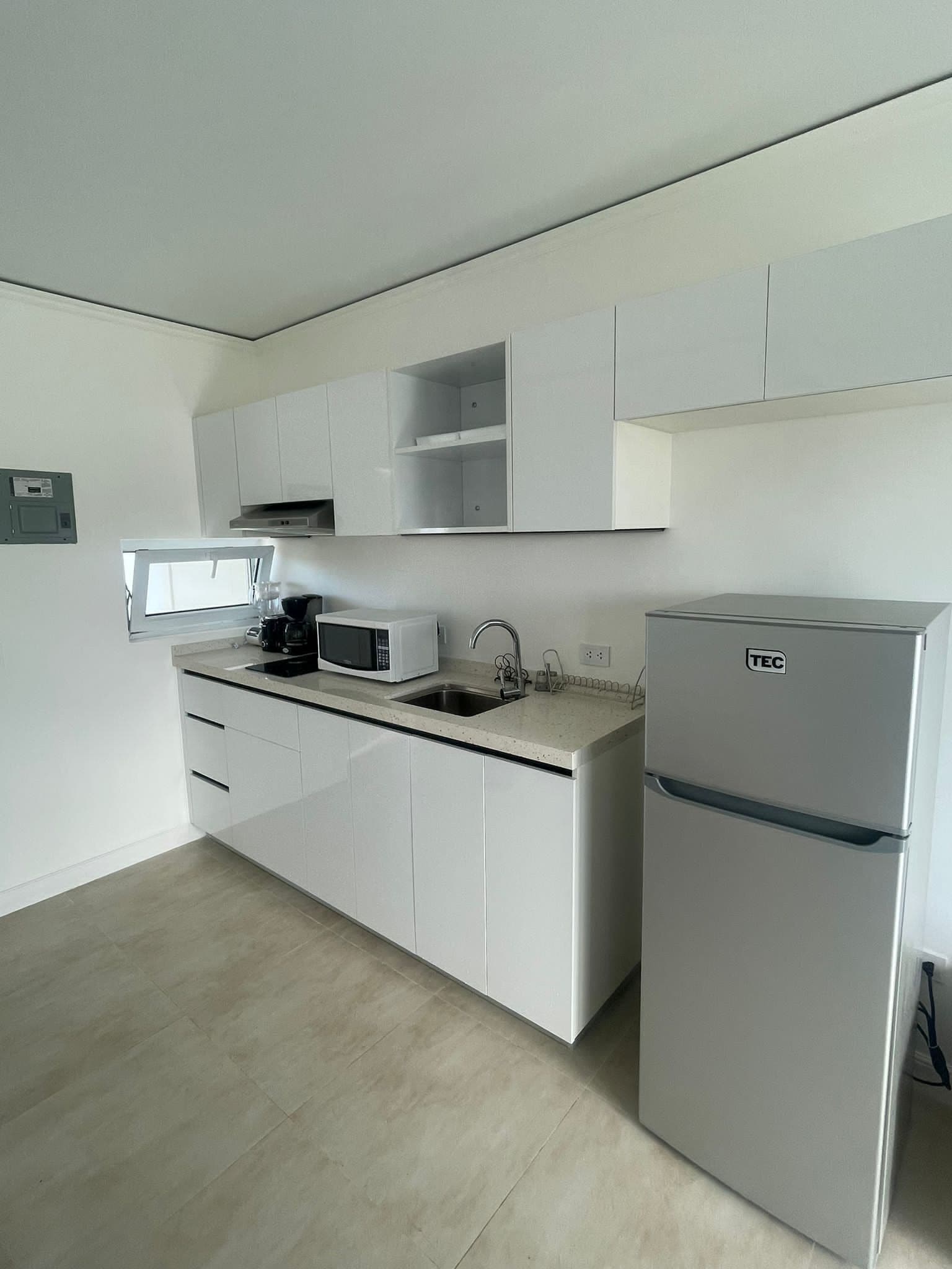 Fridge, microwave, stovetop, coffee/tea maker