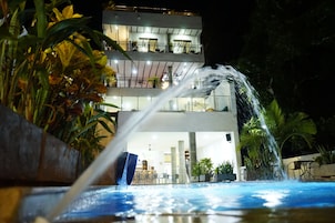 Outdoor pool, open 9:00 AM to 10:00 PM, pool umbrellas