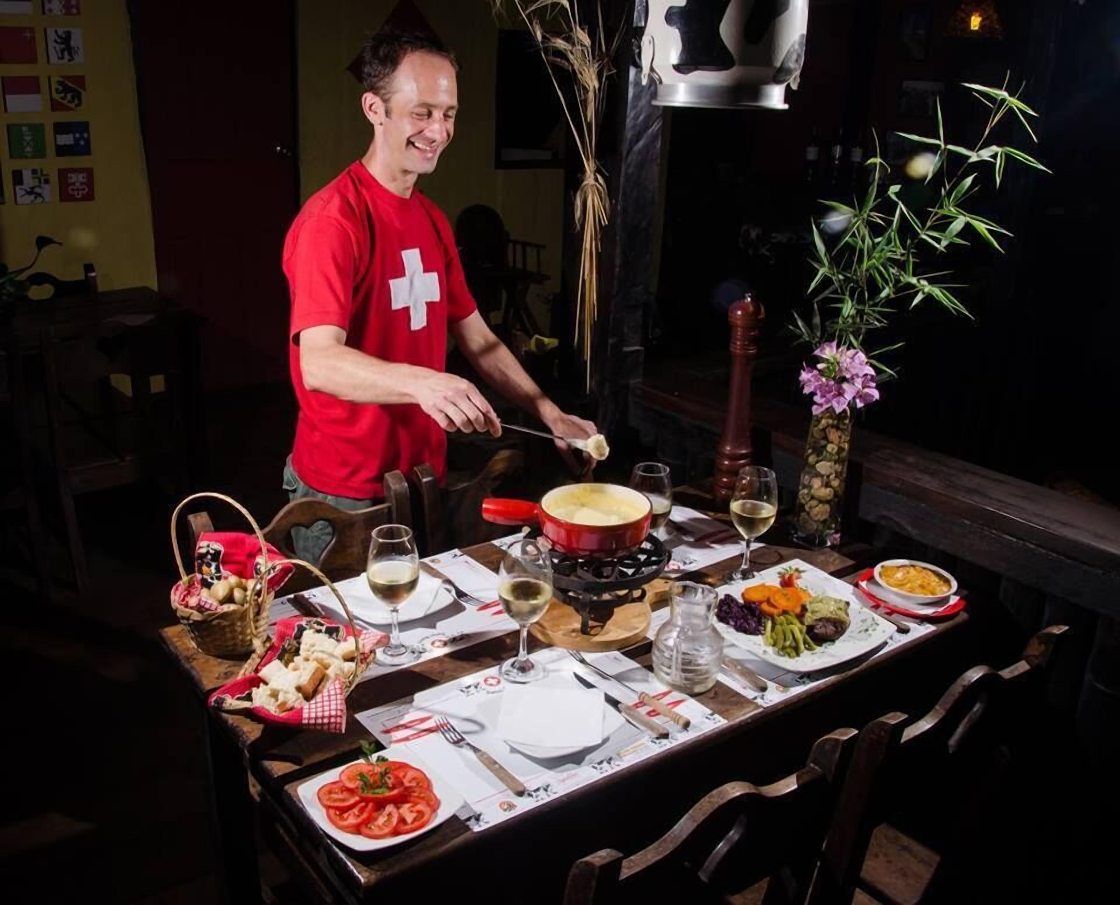 Breakfast, lunch, dinner served; fondue, pool views 