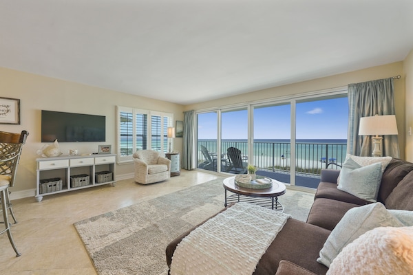 Bright beachfront condo in Destin, FL featuring private balcony access and panoramic Gulf scenery.