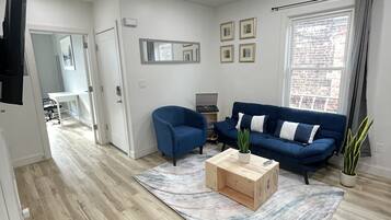 Luxury Apartment, 3 Bedrooms | Living area | 55-inch Smart TV with digital channels, TV, pay films