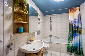 Bathtub, hair dryer, towels