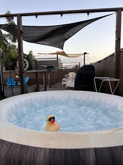 Enjoy a cozy space in a RV Camper w/hot tub, near beaches.