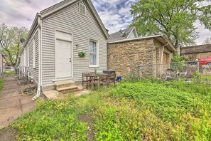 Two-story house with a well-maintained yard and patio area.