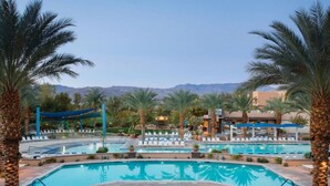 A resort pool area with multiple pools, palm trees, and lounge chairs. - Marriott's Shadow Ridge II (Palm Desert)