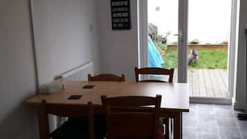 Dining area with easy access through French windows for al fresco dining.