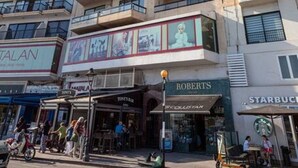 A multi-story hotel with balconies, a Starbucks, and a restaurant named 'Roberts'. - Sliema Ferries APT, with beautiful views AC & WIFI (Sliema)