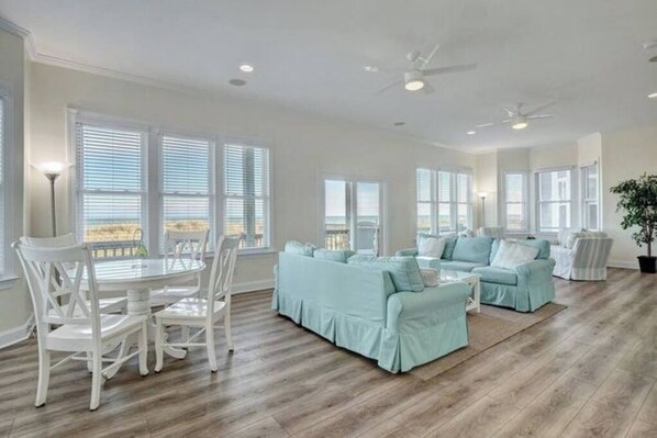 living room with tons of space to relax while taking in ocean views from all the beautiful windows! 