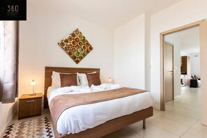 1 bedroom, desk, iron/ironing board, travel crib