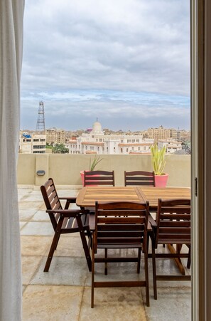 Outdoor dining - VESTA  - Luxury APT - 2BR - Merghany (Al Golf)