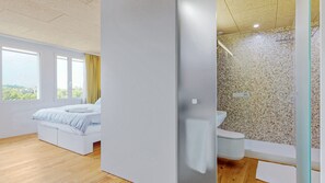 Deluxe Studio | Bathroom | Shower, hair dryer, towels, soap