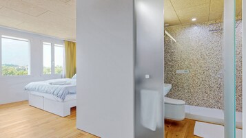 Deluxe Studio | Bathroom | Shower, hair dryer, towels, soap