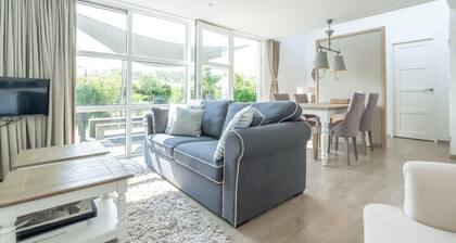 You are guaranteed to unwind and relax in one of the chairs or on the comfy sofa in the central livi