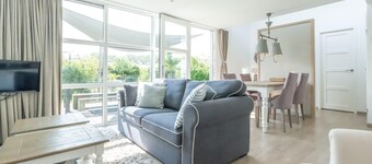 You are guaranteed to unwind and relax in one of the chairs or on the comfy sofa in the central livi