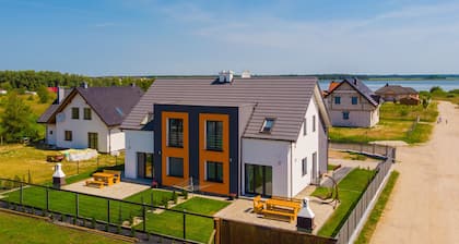 Haus KATAMARAN Ostsee Seeblick Garten Terrasse Grill W-Lan Spielplatz Angeln