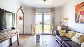 Panoramic Double Room | Living area | Flat-screen TV