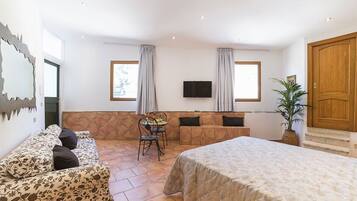 Deluxe-Studiosuite, Terrasse | Italienische Bettbezüge von Frette, hochwertige Bettwaren