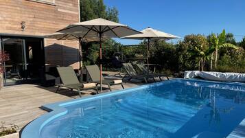 Outdoor pool, pool umbrellas, pool loungers